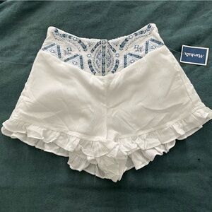 Indigo Rein White High-Waist Ruffle Shorts with Blue Embroidery